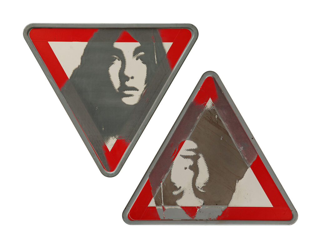 This untitled artwork by Hooman Derakhshandeh , is from his latest series Discourse, currently displayed at Etemad Gallery II. The portrait of the woman engraved on the used traffic sign, is from his painting "Replica" which was part of the artist's 2009 series "Contradiction". By forging together the two representations into one object, Derakhshandeh redefines a new identity. As a result, in our constant urge to identify ourselves through our surroundings, we leave irremovable trace marks on them, unaware that, in fact, we are the ones who are defining not only ourselves, but our surroundings as well.